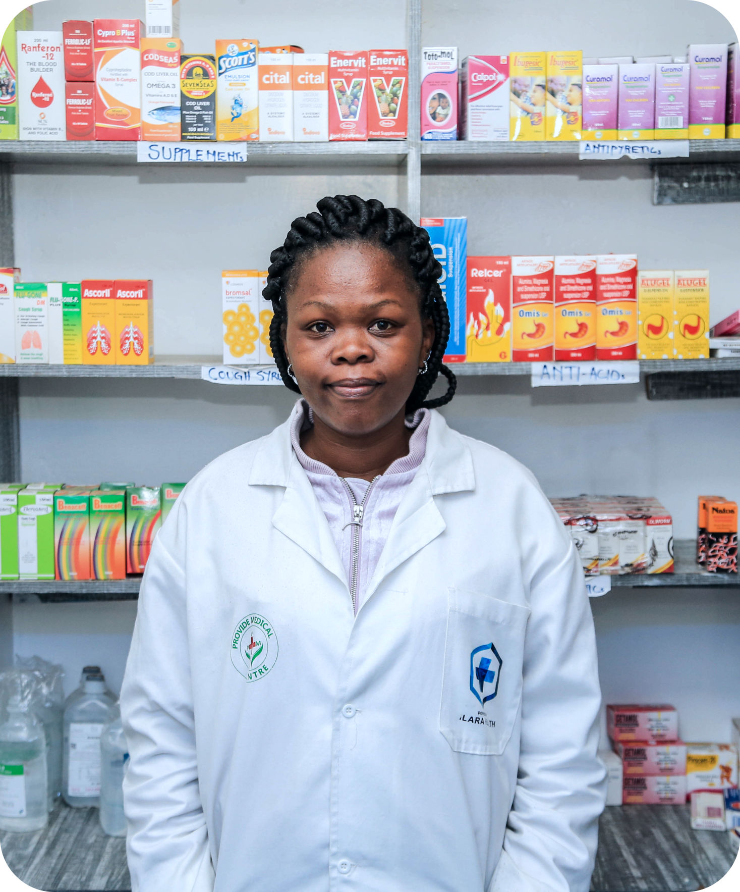 Practitioner standing infront of the pharmacy